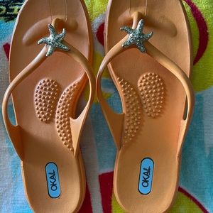 OKA B orange flip flops. Excellent condition.